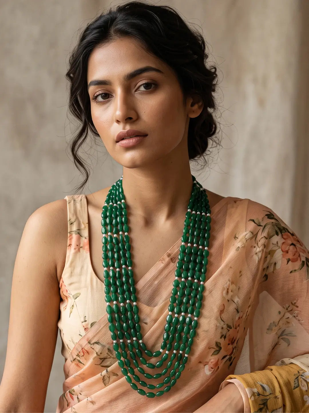 Layered green jade beaded necklace showing the gold-plated detailing and the adjustable dori closure at the back of the necklace
