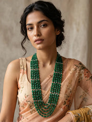 Layered green jade beaded necklace showing the gold-plated detailing and the adjustable dori closure at the back of the necklace
