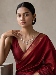 Minimal chain necklace with multiple Polki-style drops and matching floral stud earrings, designed for party wear, festive outfits and modern ethnic looks.