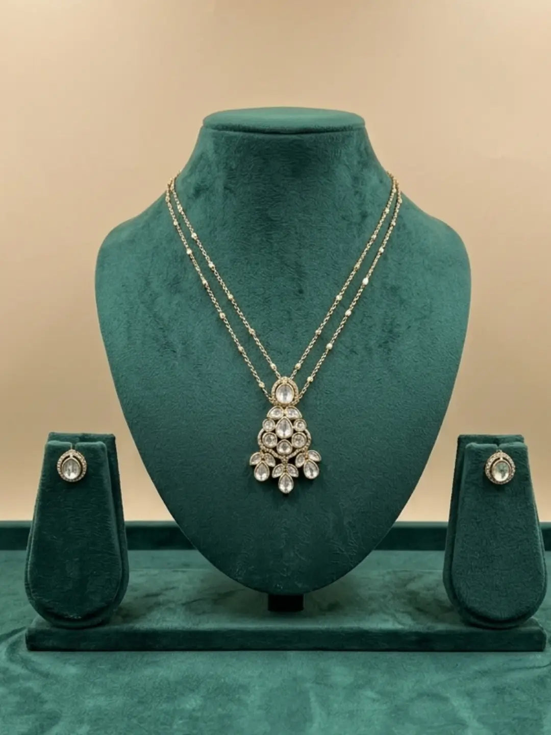 White stone teardrop Polki pendant necklace with matching stud earrings, a minimal gold plated jewellery set for everyday and festive outfits.