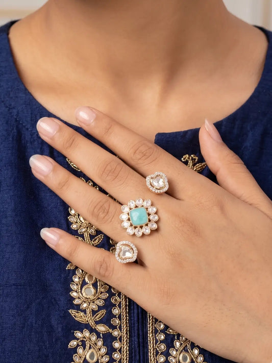 Mint green Kundan Polki and CZ double finger ring with gold plating, featuring a floral design for bridal, wedding and festive occasions.