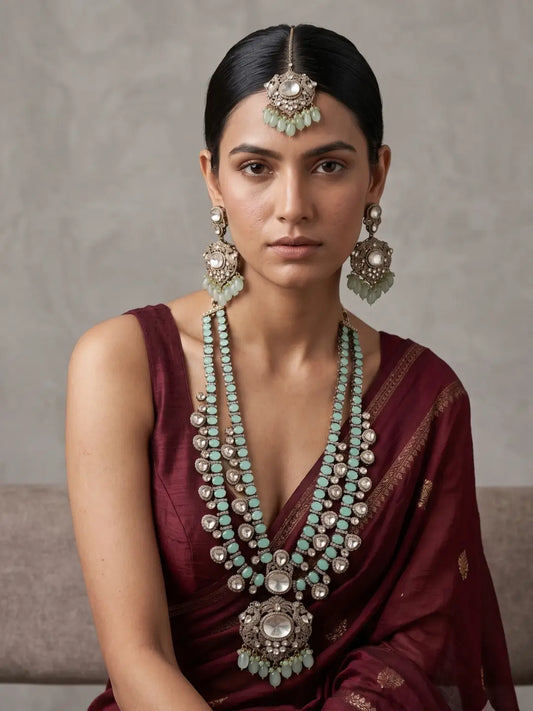 Mint green Moissanite Polki bridal necklace set with layered motifs, statement pendant, long earrings and matching tikka.