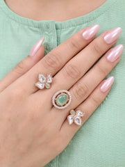 Mint green Polki Kundan dual finger ring with two-band design, floral stone clusters, pear-shaped Polki details and gold-tone finishing for celebrations