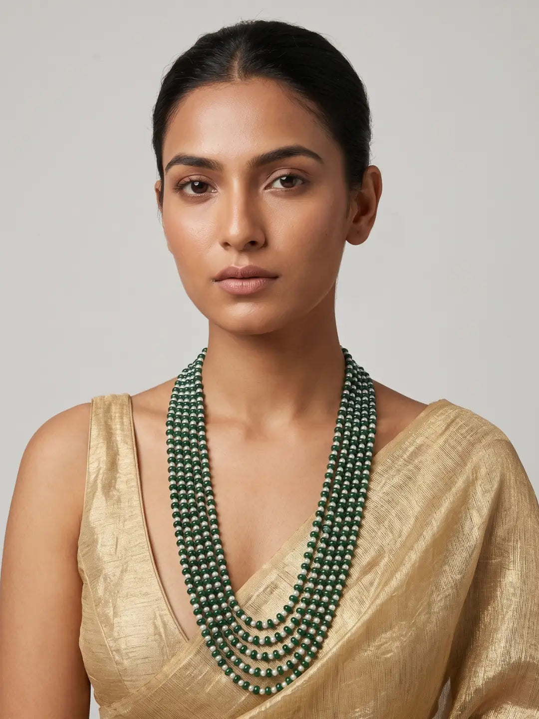 Multi-strand freshwater pearl and green jade beaded necklace for women with graduated layers and an elegant ethnic jewellery design.