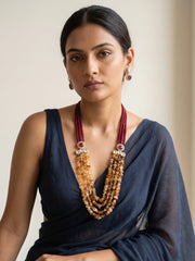 Multi-strand necklace set featuring deep-red jade beads, yellow citrine chip beads, Kundan accents and matching earrings.