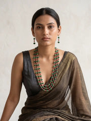 Multi-strand red and green jade necklace featuring watermelon-shaped beads, pearl spacers and gold-toned detailing.