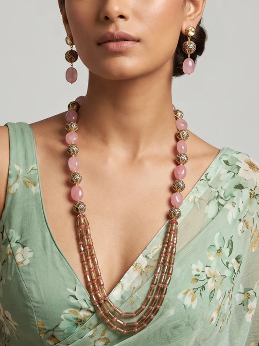 Multi layer pink jade beaded necklace set with gold-tone metallic beads, cascading strands and matching long-drop earrings for festive ethnic styling
