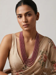 Multi strand ruby red jade and natural freshwater pearl mala with gold-plated details, designed as layered ethnic jewellery for weddings and festivals.