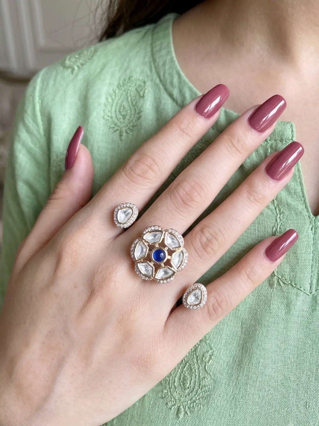 Navy Polki Kundan double finger ring with two gold-tone bands, floral stone clusters and sparkling CZ details for wedding and cocktail party styling