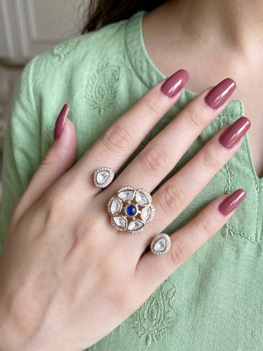 Navy Polki Kundan double finger ring with two gold-tone bands, floral stone clusters and sparkling CZ details for wedding and cocktail party styling