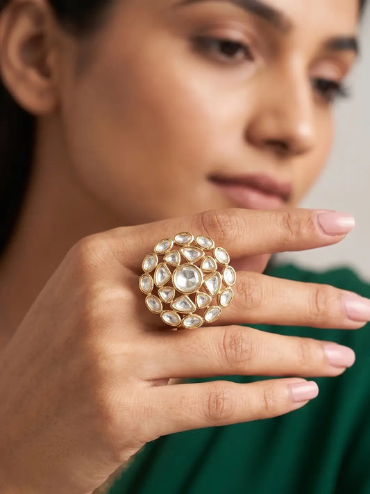 Oversize Polki Kundan statement ring featuring a round centre stone, pear and oval Polki stones in a detailed floral gold plated design

