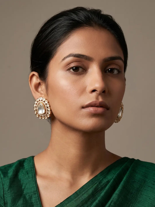 Oversized white Polki stud earrings with teardrop centre stone, concentric CZ and Polki detailing, and gold plated floral setting