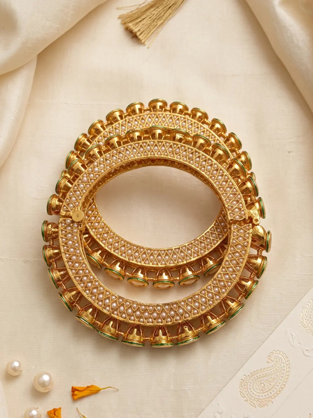 Pearl and green Meenakari Kundan Pacheli bangles with gold plating, designed for bridal, wedding, mehendi and festive jewellery styling.
