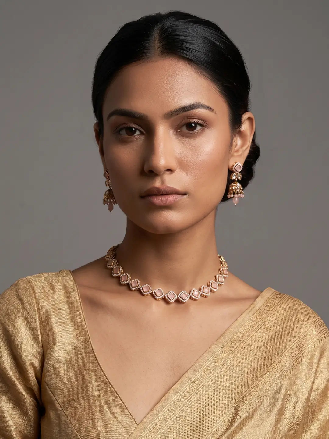 Pink CZ and Polki stone choker necklace set with matching jhumka earrings and gold-tone detailing for Indian wedding jewellery.