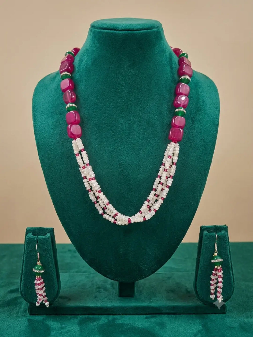 Pink jade and rainbow moonstone jewellery set with matching statement earrings featuring cascading pink, white and green bead strands.