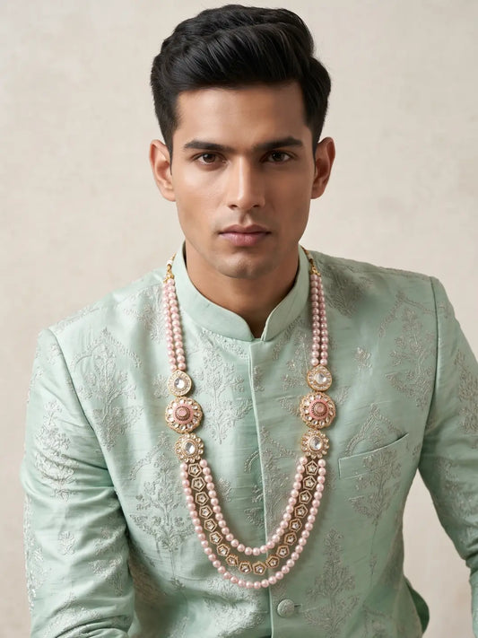Pink shell pearl Kundan dulha mala with layered beads, ornate Polki brooches and CZ accents, designed for traditional Indian groom sherwanis.