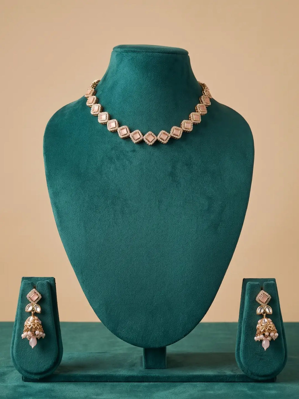 Pink Polki and Kundan-style choker necklace featuring CZ stones and matching jhumka earrings for sarees, lehengas and festive outfits.