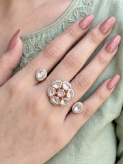 Pink Polki Kundan double finger ring featuring two connected gold-tone bands, floral stone clusters and CZ details for wedding and Sangeet styling