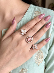 Pink Polki Kundan dual finger ring with two connected bands, floral clusters, pear-shaped Polki stones and gold-tone detailing for wedding celebrations