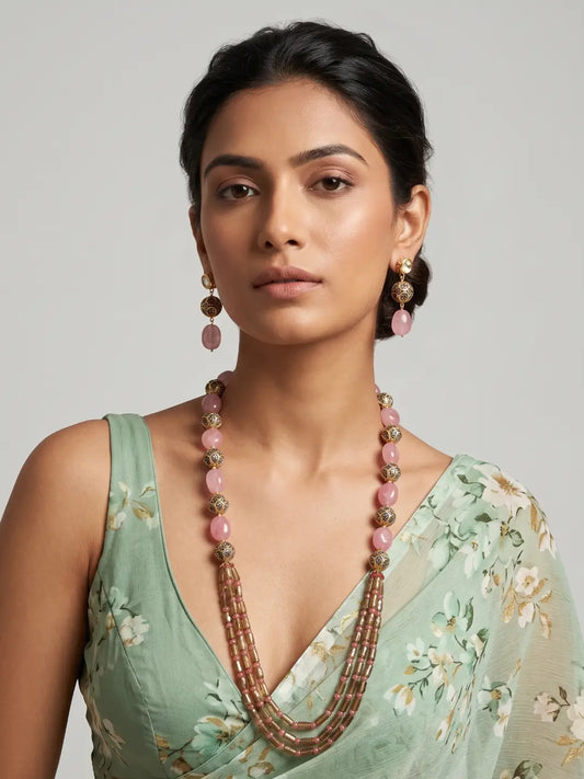 Pink stone beaded statement necklace featuring smooth jade beads, layered strands, gold-tone accents and matching earrings for wedding celebrations