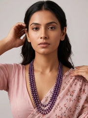 Purple amethyst and freshwater pearl layered necklace featuring multiple strands of natural gemstone beads for traditional and festive wear.