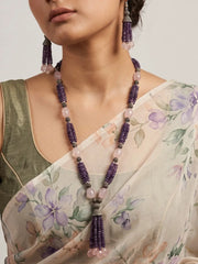 Long purple and pink beaded necklace set with faceted amethyst clusters, rose quartz teardrop beads and tassels, shown with matching drop earrings