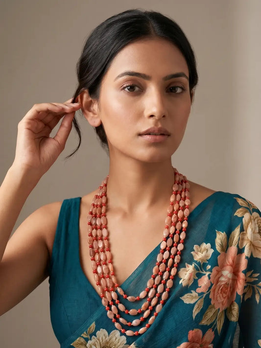 Red coral and natural moonstone beaded mala featuring smooth round coral and oval moonstone beads for sarees, lehengas and festive outfits.