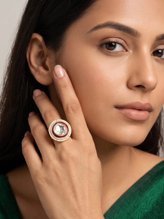 Red enamel Polki statement ring featuring a large faceted centre stone, sparkling CZ accents and tiny pearl detailing in a gold plated finish
