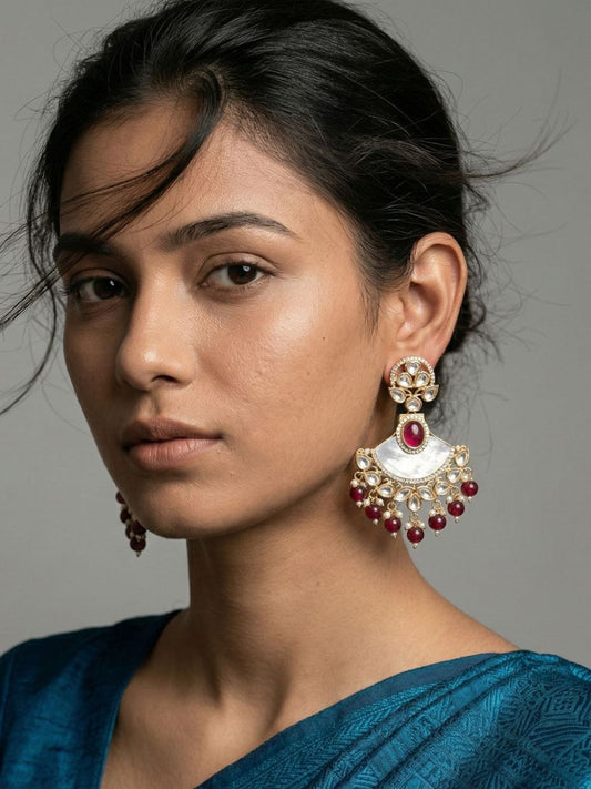 Red gold plated Chandbali earrings with mother of pearl, Kundan and Polki detailing, gemstone beads and pearl danglers for bridal wear.