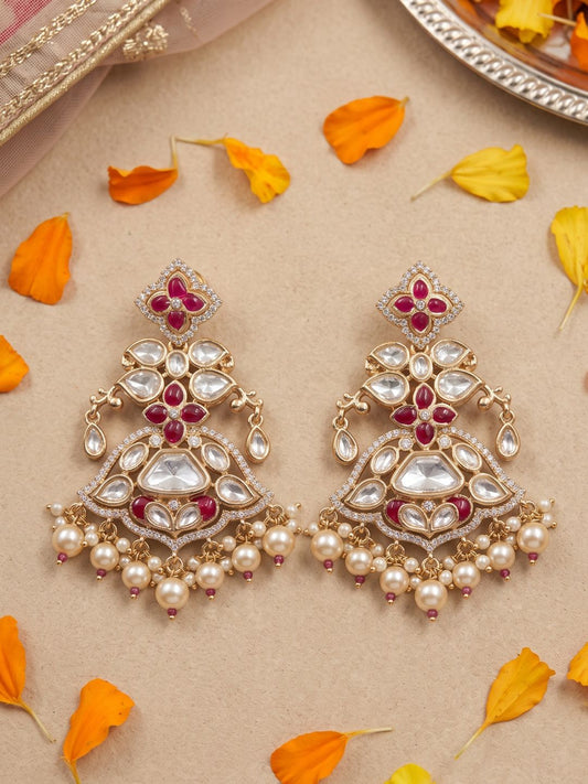Elegant red Chandbali earrings featuring Kundan and Polki stonework, floral enamel detailing, sparkling American diamonds and pearl danglers.