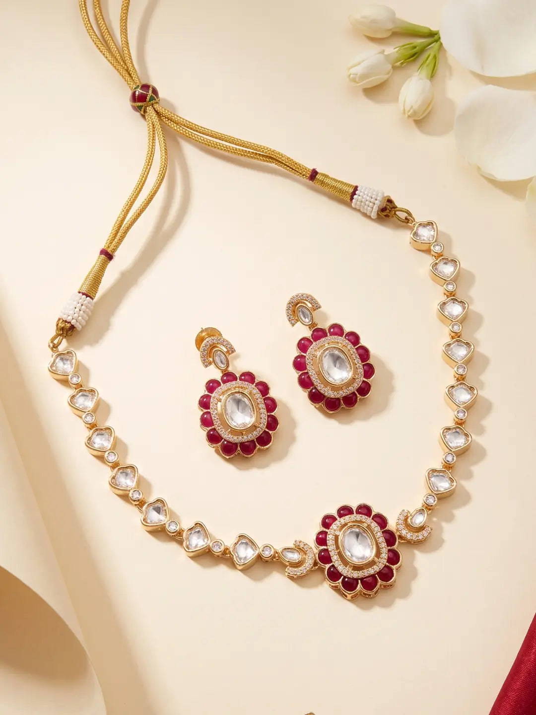 Red Kundan Polki choker necklace with geometric enamel motif, white stone accents and matching earrings for mehendi, sangeet and weddings.