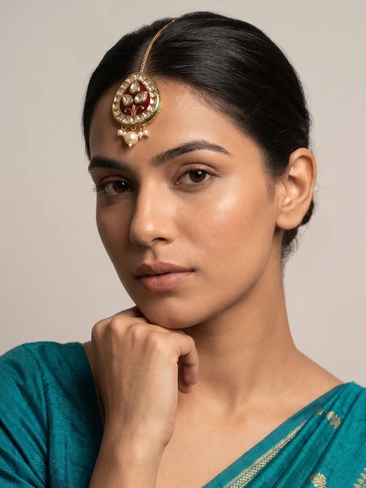 Red Meenakari Kundan Maang Tikka with Teardrop Silhouette Styled on Model for Traditional Indian Wedding Wear