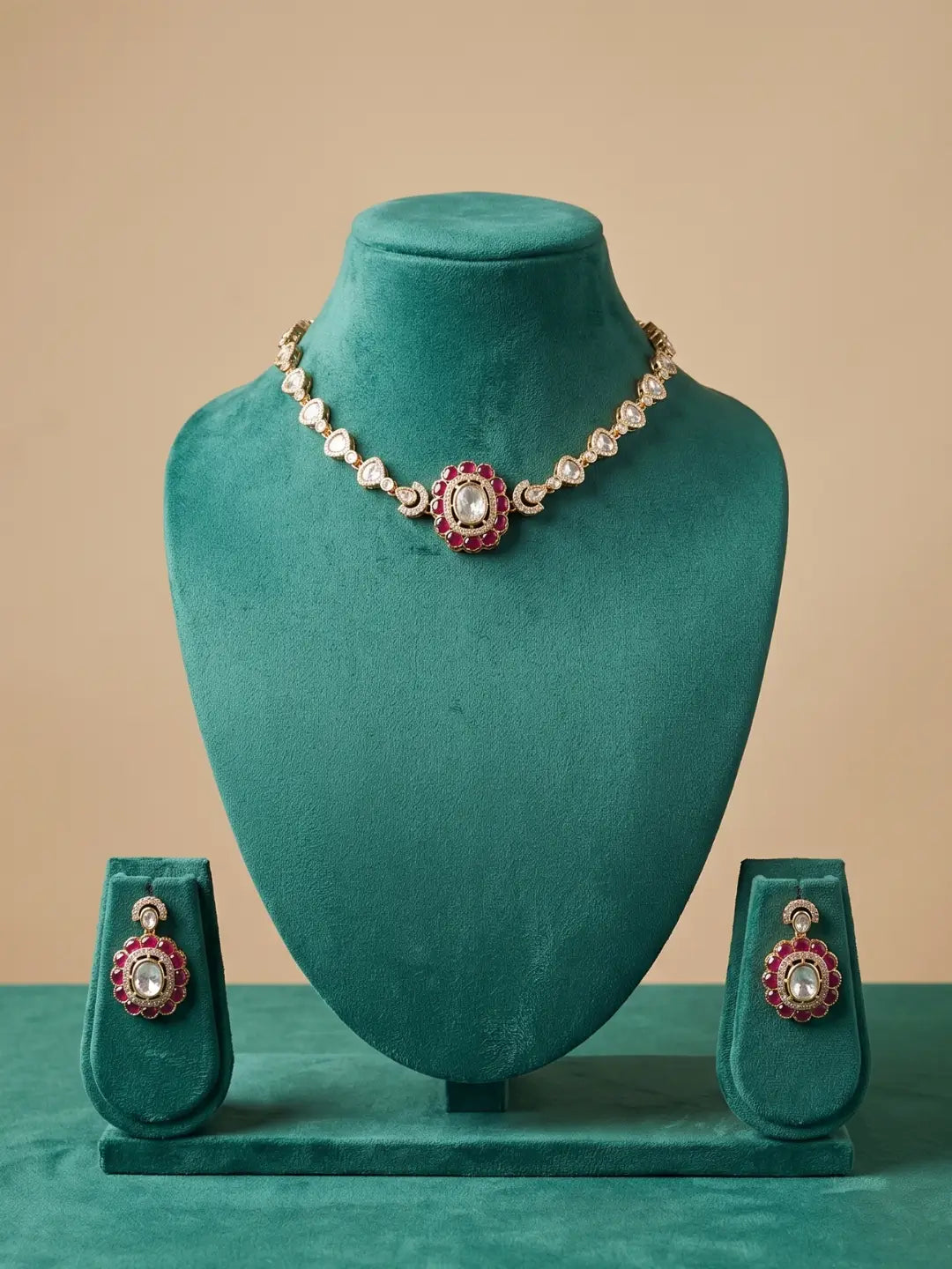 Red Polki Kundan statement choker set featuring CZ stones, enamel detailing and matching earrings, styled with traditional Indian outfits.
