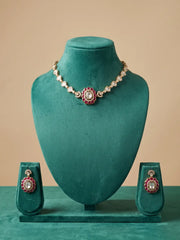 Red Polki Kundan statement choker set featuring CZ stones, enamel detailing and matching earrings, styled with traditional Indian outfits.
