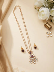 Red teardrop pendant framed with Polki and CZ stones, accompanied by matching stud earrings in a coordinated gold plated design.