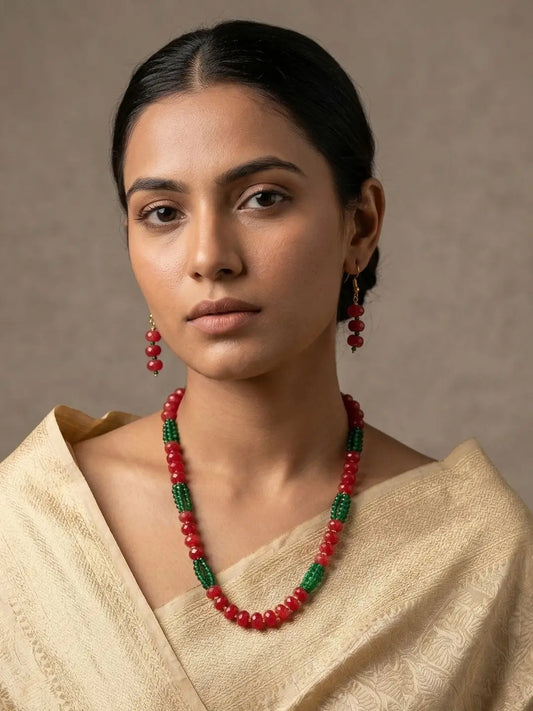 Red and green beaded necklace set with faceted jade beads, layered green hydro beads, gold-tone accents and matching drop earrings for festive styling