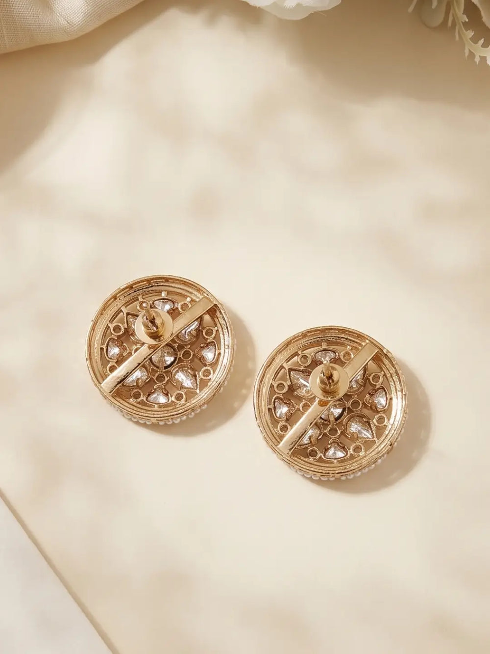 Round pearl and Kundan statement earrings with intricate gold toned centre, CZ and Polki detailing for saree and lehenga styling