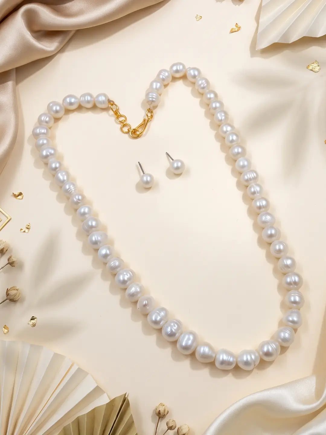 Pair of round white pearl stud earrings with and push backs, shown as the matching earrings of the pearl necklace set