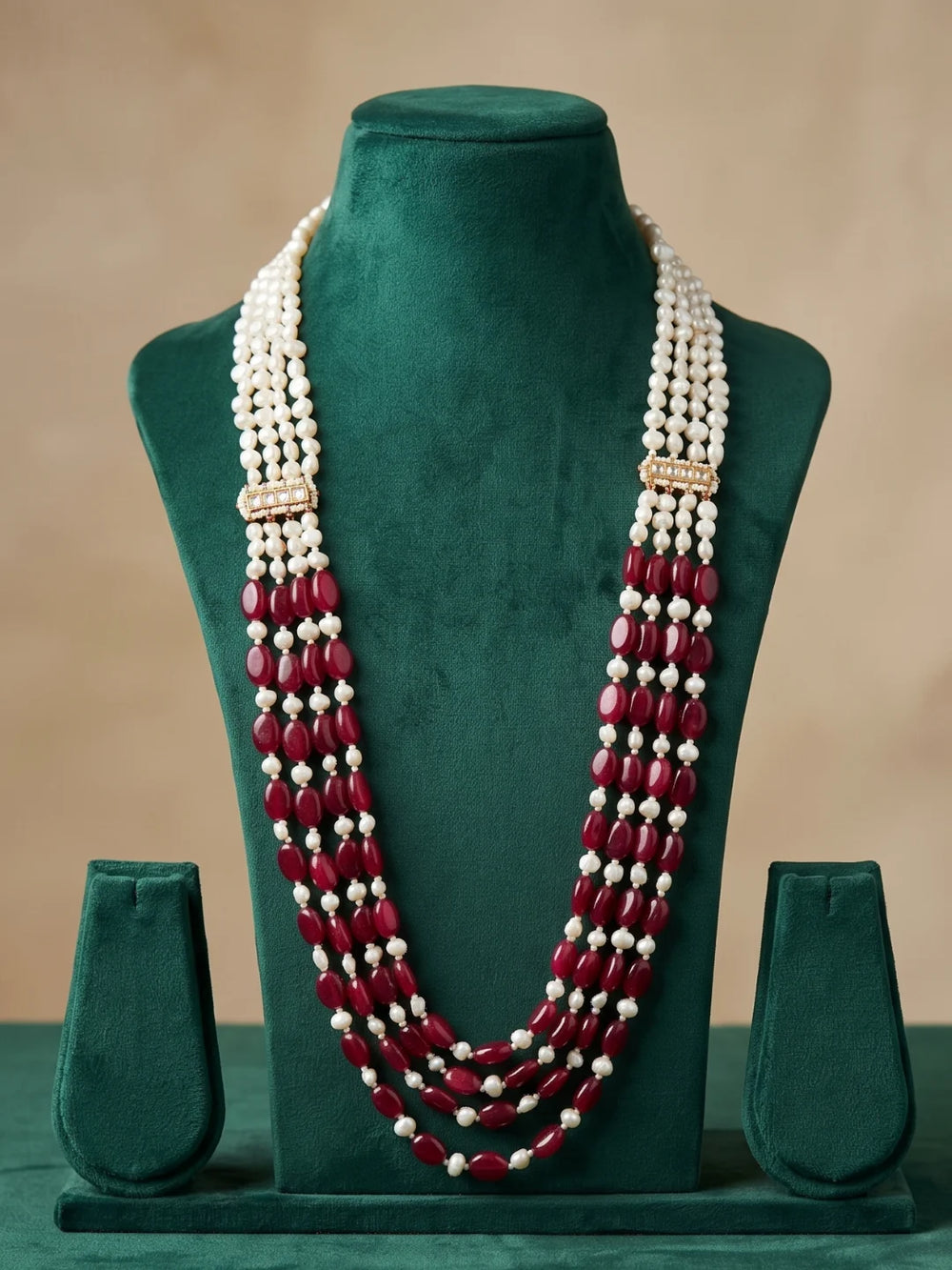 Designer dulha necklace with red jade beads and irregular white freshwater pearls arranged in graduated strands for traditional wedding ceremonies.