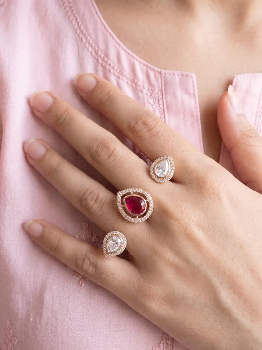 Ruby pink gold plated Kundan Polki dual finger ring with pear-shaped CZ details, styled for bridal, wedding and festive jewellery looks.