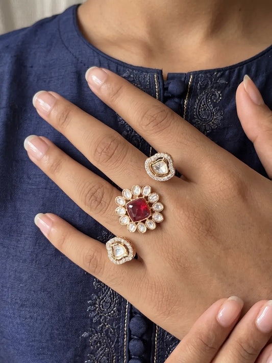 Ruby pink Kundan Polki and CZ double finger ring with gold plating, featuring a floral design for bridal, wedding and festive looks.