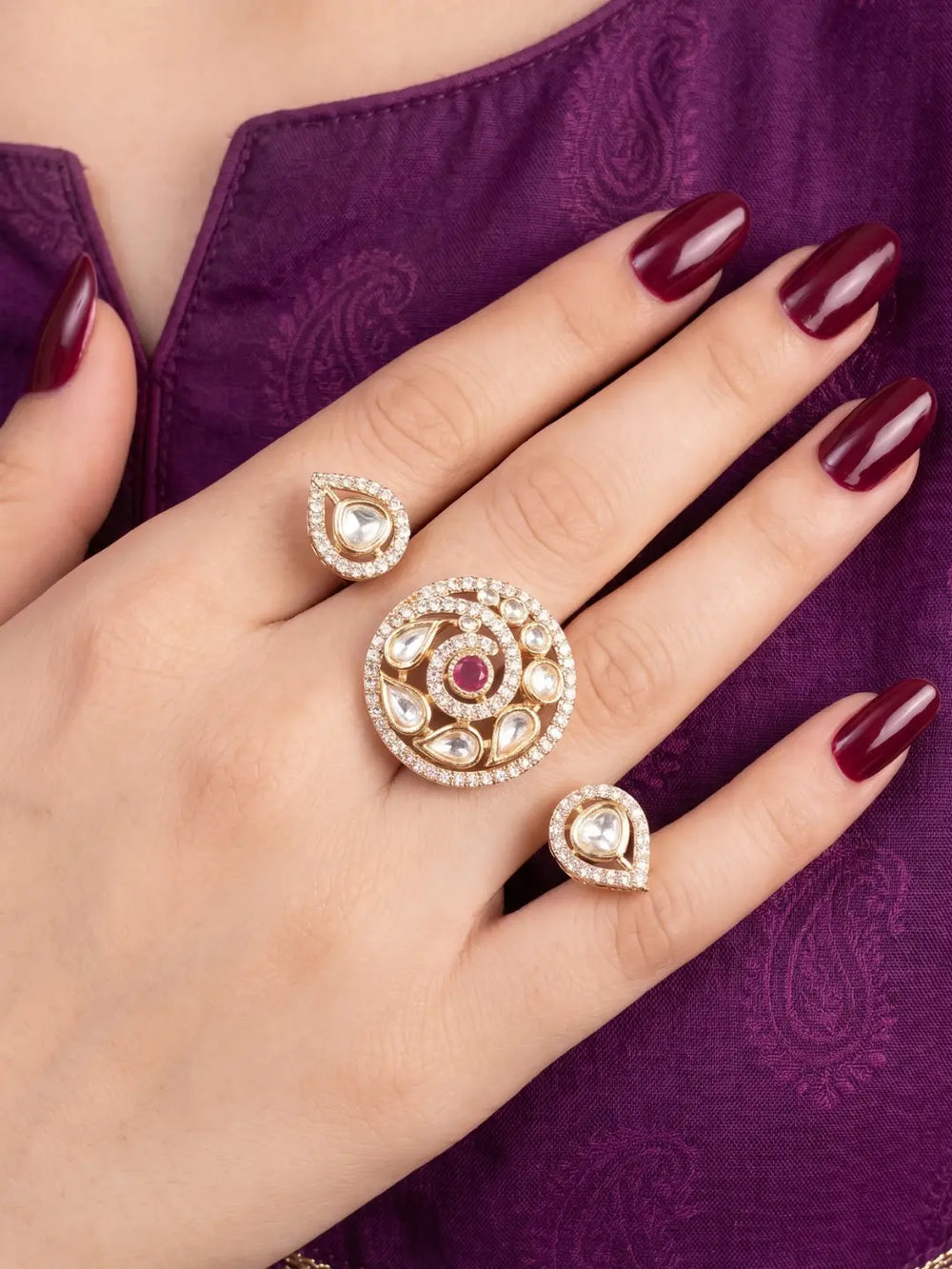 Ruby pink Kundan Polki dual finger ring with two connected gold-tone bands, floral stone clusters and CZ detailing for bridal and festive styling
