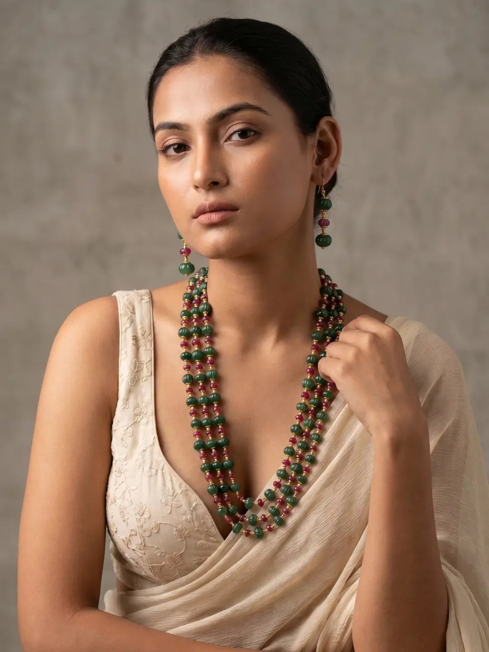Ruby red and green watermelon-shaped jade beaded mala with multiple strands and pearl spacers for traditional Indian styling.