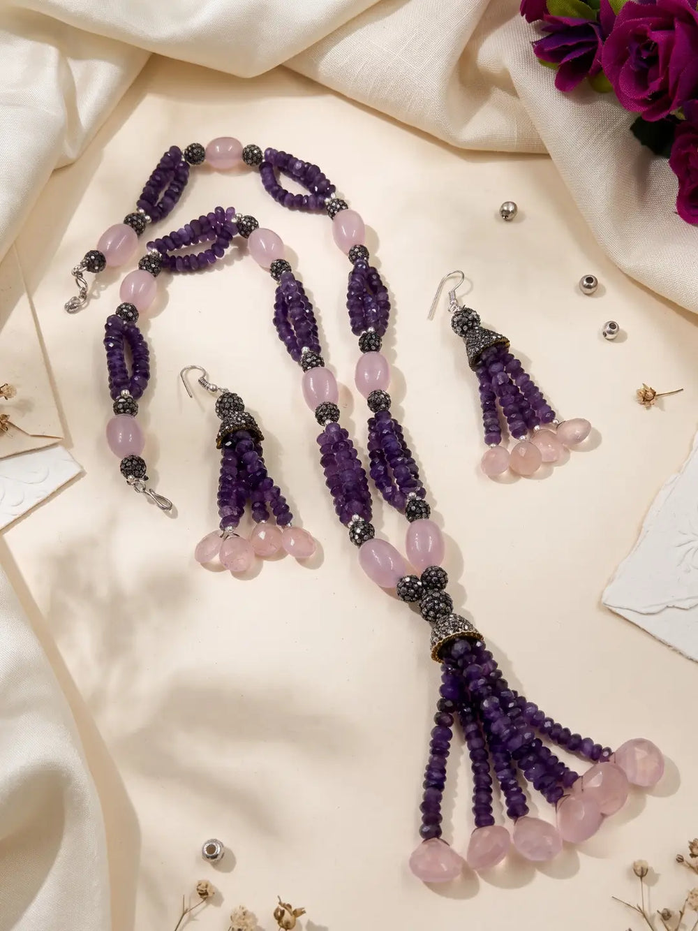 Matching drop earrings with complementary purple bead tassels and pink bead accents, designed to coordinate with the amethyst tassel necklace