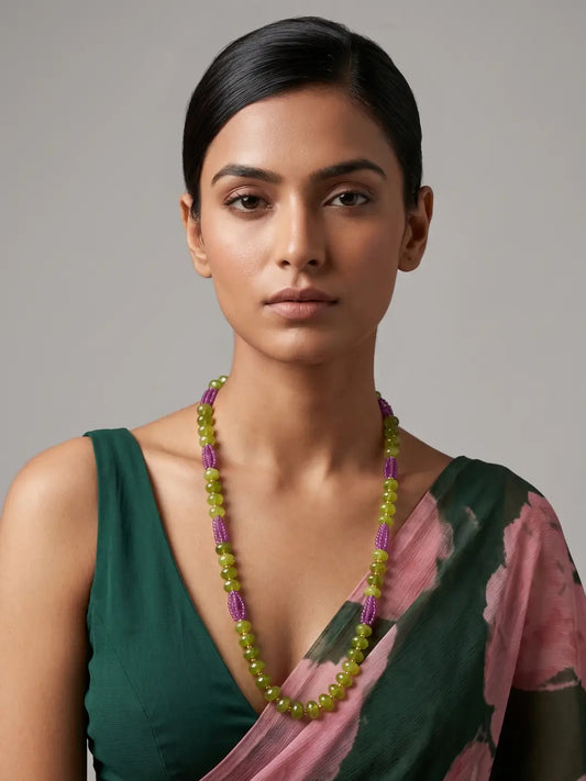 Single layer green jade and pink hydro bead necklace with an elongated silhouette and subtle gold-tone details, suitable for sarees and kurtis