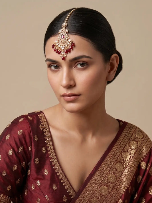 Statement Maroon Kundan Polki Maang Tikka with Cascading Pearl Details Styled on Indian Model for Wedding Wear
