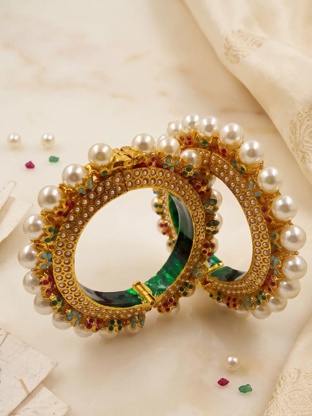 Traditional gold plated Pearl Pacheli Jadau bangles with colourful stones and pearl accents, ideal for sarees, lehengas and festive outfits.