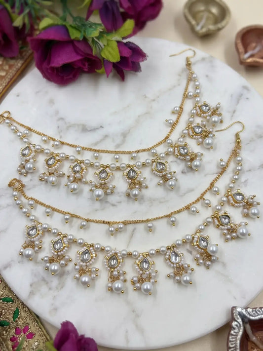 Close-up of traditional Kundan pearl Kaan Sahar showing teardrop stones, faux pearl clusters and dangling pearl details around the ear for Indian bridal jewellery styling.