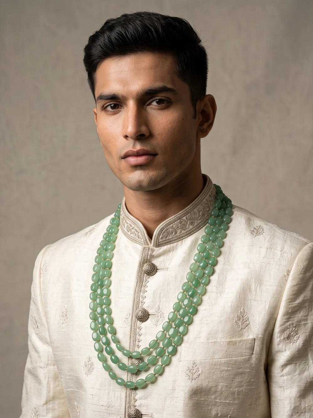 Triple layer mint green groom necklace with repeating polished jade beads, subtle gold-tone details and an adjustable dori fit.