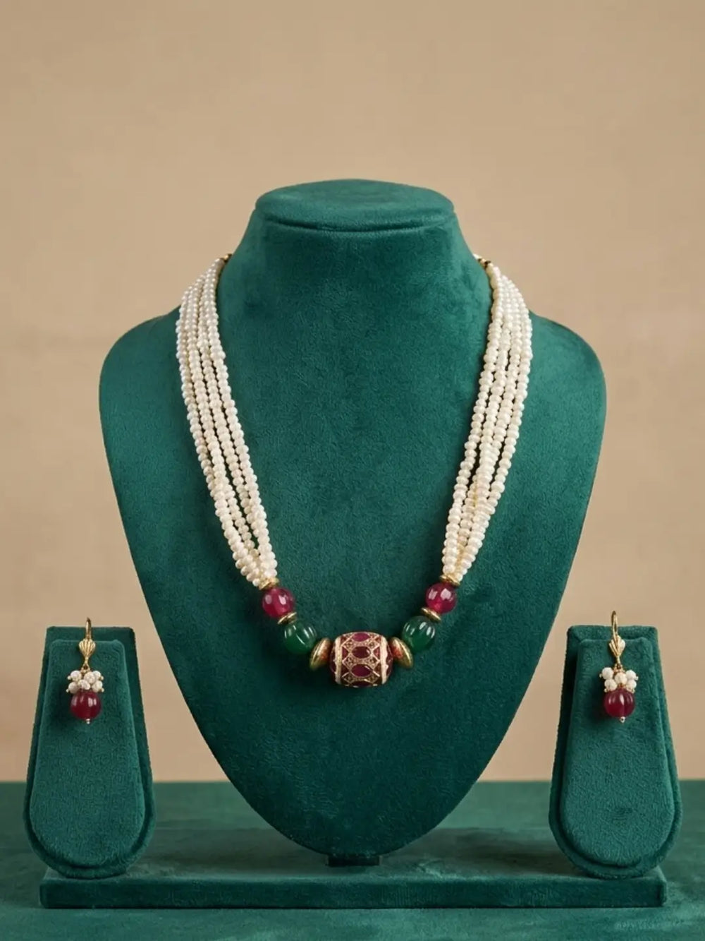 Traditional pearl jewellery set with multiple freshwater pearl strands, red and green jade beads and matching lever-back earrings.
